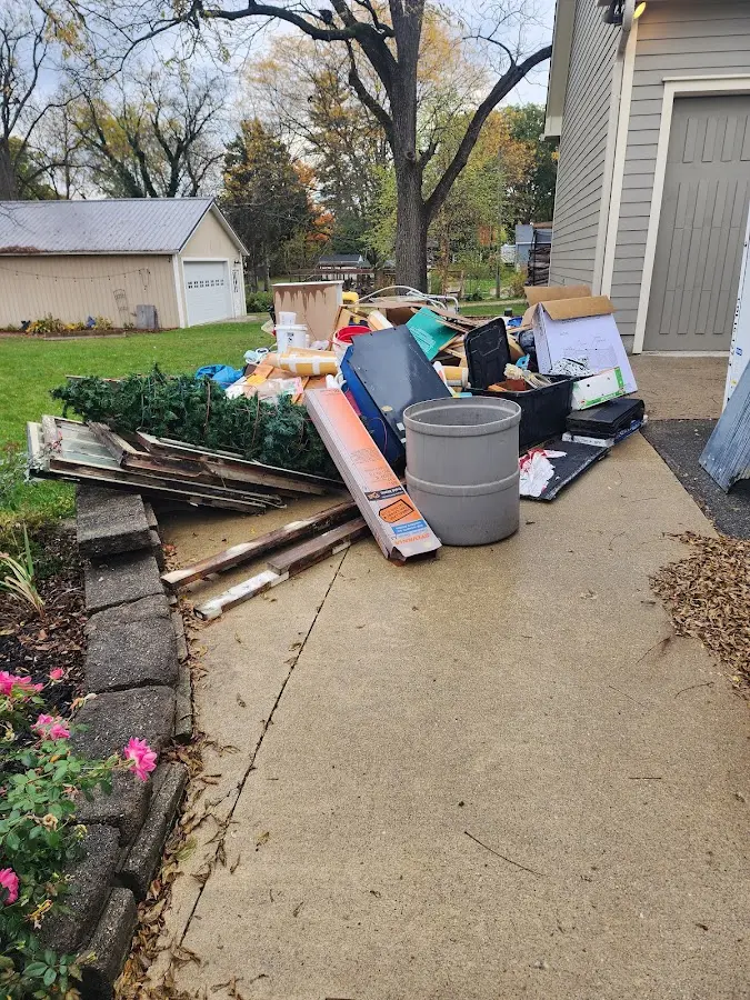 Dumpster being loaded with debris for 3 Yard Dumpster Rental in Glasgow Village